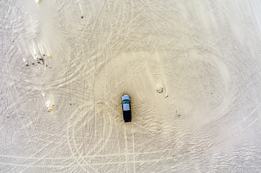 Aerial view of a truck in the Nevada desert near 
Sand mountain recreation area.