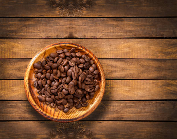 istock Coffea - Brown roasted coffee beans in the bowl 1409960260