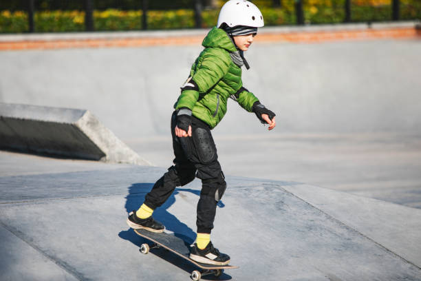 istock Child skateboarding in skateboarding park 1409960852