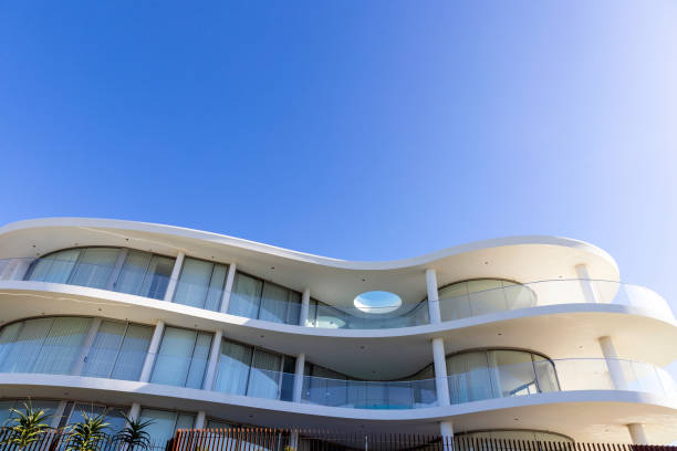 istock Brand new, modern apartment building, front view, sky background with copy space 1409965101