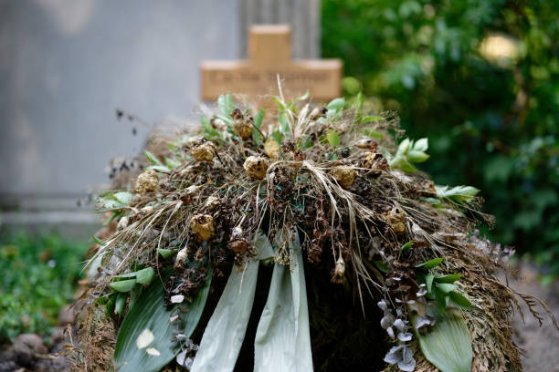 istock dried up flower decoration on a grave 1409968702