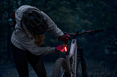Young woman on a night e-bike ride