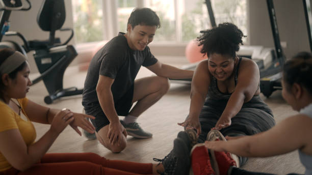 istock Group of friends exercise in the gym 1409971750
