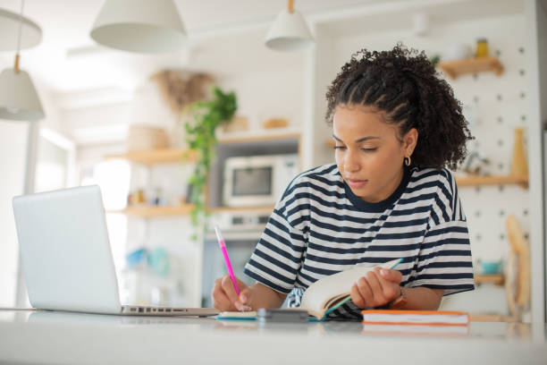 istock Young woman working from home 1409972712