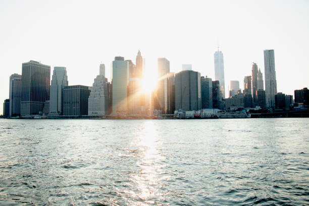 istock New York City skyline, sunlight, glittering water 1409974663