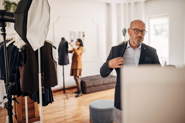 istock Man trying on suit in clothing store 1409979171
