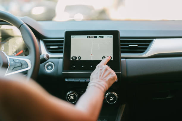 istock woman operating her car's navigator 1409981008
