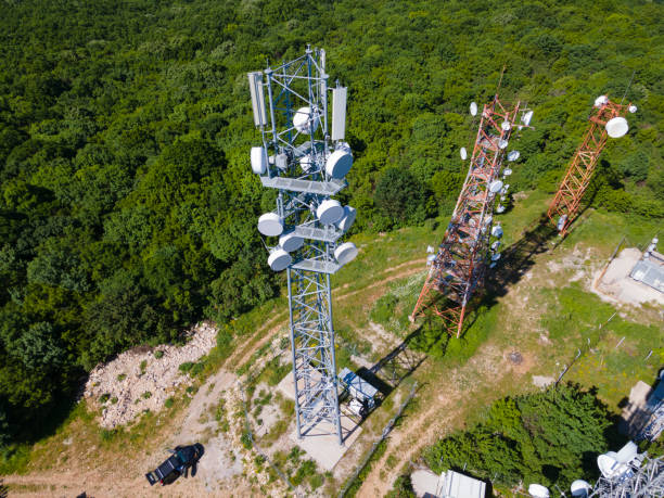 istock Telecommunication towers in greenery, aerial view. 1409982095