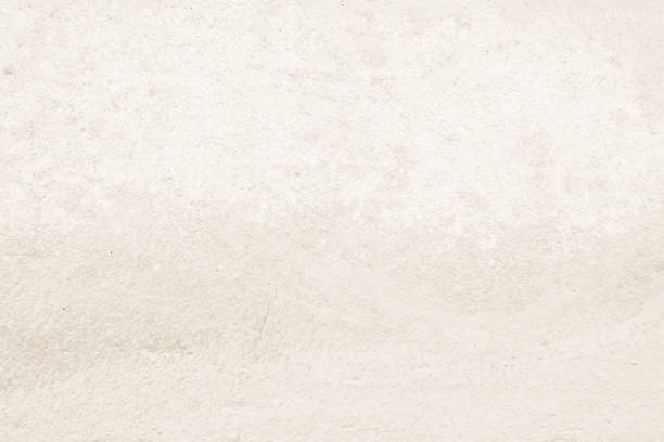istock Old concrete wall texture background. Close up retro plain beige color cement material surface rough for show or advertise promote product content on display and brown paper design element concept. 1409982112
