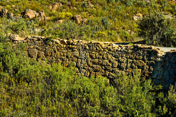 Old beautifully crafted stone road embankment