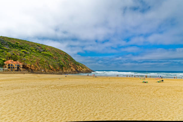 istock Pristine Herolds Bay beach with swimmers 1409983567