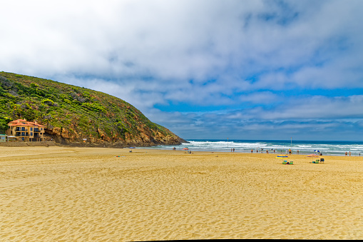 Pristine beach at Herolds Bay beach with people swimming near George, Garden Route, Western Cape, South Africa