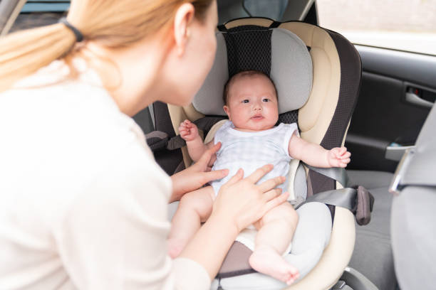 istock cute baby , child seat 1409984428