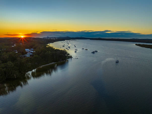 istock Sunrise over the river with a boat 1409987655
