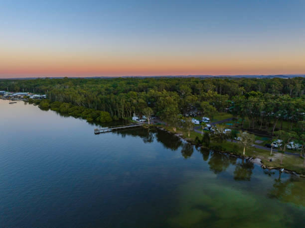 istock Sunrise over the river and holiday park 1409987656