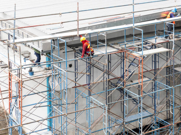 istock The construction worker is working on the high scaffolding. 1409990386