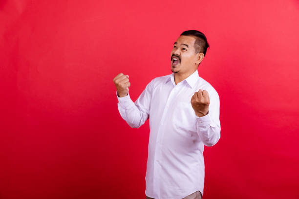 istock Bearded mature man portrait in red background. 1409993296