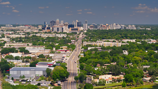 Aerial shot of Orlando, Florida on a sunny day in spring, looking along Orange Avenue towards the downtown skyline.   \nAuthorization was obtained from the FAA for this operation in restricted airspace.