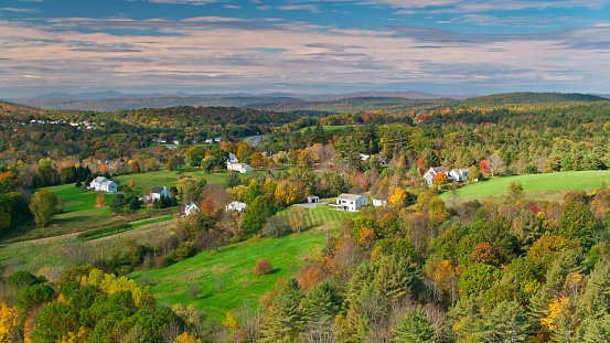 Aerial shot of homes and nature in  the New Hampshire countryside in Autumn.