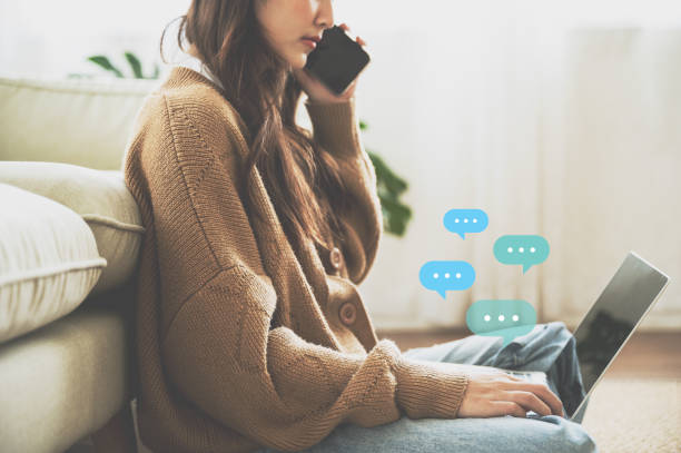 istock Woman sitting on the floor and using computer laptop. Online message live chat chatting on application communication digital media website and social network 1409994824
