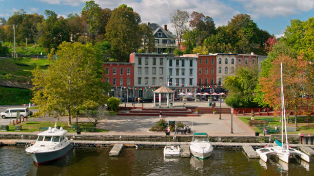 Low Drone Shot of Boats Docked in Kingston, New York Aerial shot of Kingston, New York on a partly cloudy day in autumn. kingston harbour stock pictures, royalty-free photos & images