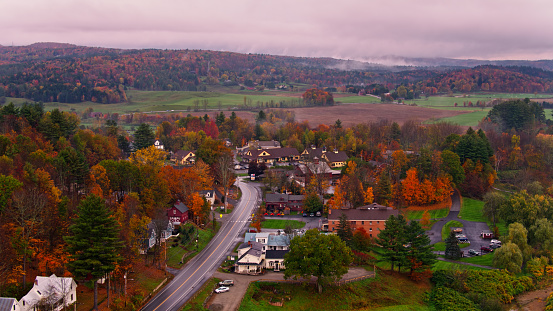 Aerial shot of Stowe, Vermont on a foggy autumn day. Stowe is a resort town noted for snow sports, mountain biking, hiking and spas.