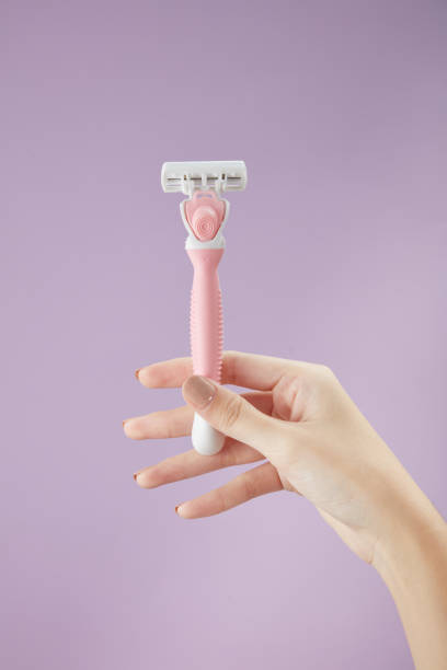 istock A moment of using razor blade on hand in color background 1409995996
