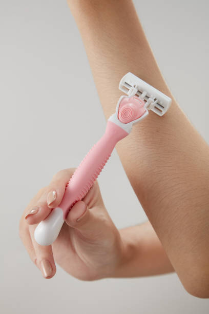 istock A moment of using razor blade on hand in color background 1409996594