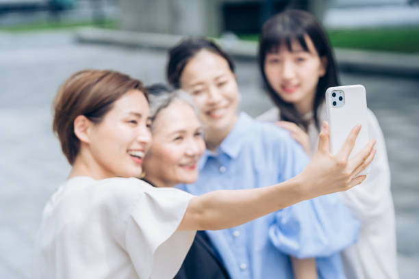 istock Women of various ages taking commemorative photos 1410001079