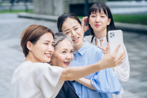 istock Women of various ages taking commemorative photos 1410001095