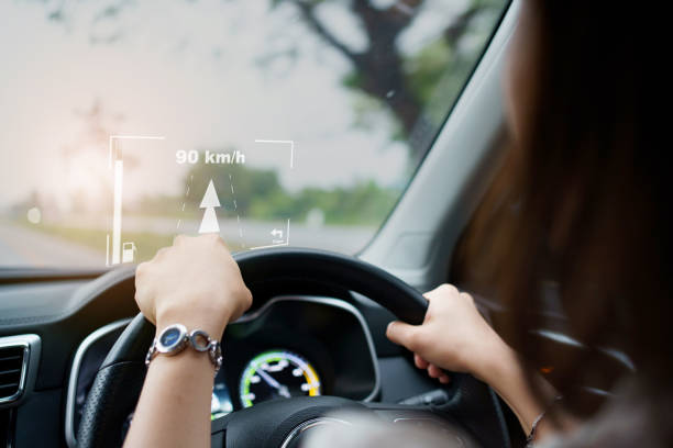Woman driving with HUD in windshield stock photo