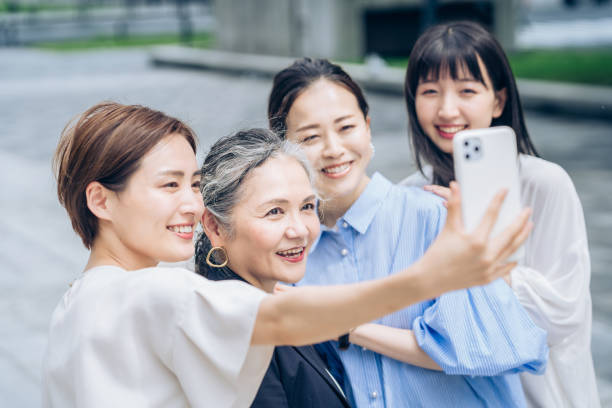 istock Women of various ages taking commemorative photos 1410001266