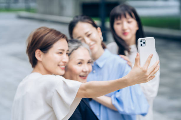 istock Women of various ages taking commemorative photos 1410001287