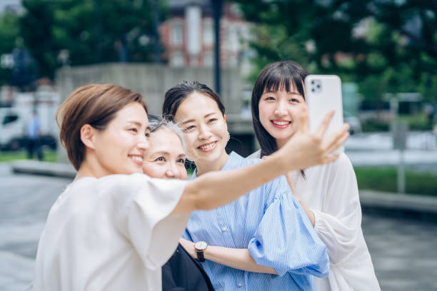 istock Women of various ages taking commemorative photos 1410001309