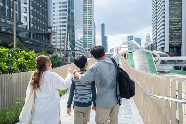 istock Parents take their Asian son home. 1410002141