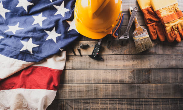 istock Happy Labor day concept. American flag with different construction tools on dark wooden background. 1410002882