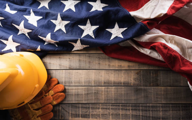 istock Happy Labor day concept. American flag with different construction tools on dark wooden background. 1410002894