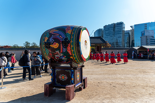 A gong against blue sky, its a percussion instrument originating in East Asia and Southeast Asia