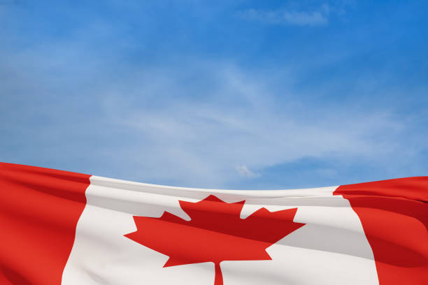 istock Canada national flag waving on blue sky. 1410010041