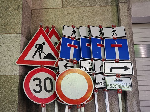 Cars moving on the road in city. View to the traffic with signs, trafficlights and vehicle