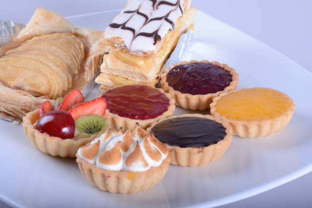 istock homemade fresh fruit pies  with strawberries apple and fruit jam raspberries blueberries on white bowl 1410010968