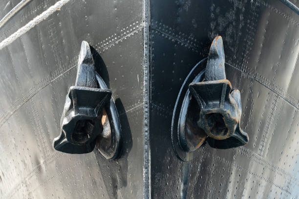 istock Two anchors on vessel board, steel vintage cargo ship 1410015475