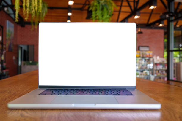 istock Laptop computer with blank screen on table of a cafe,Laptop with blank screen on table of cafe blur background 1410016066
