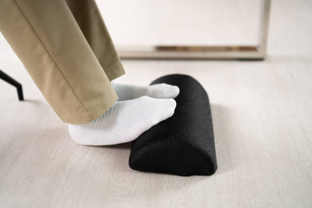 istock Footrest Against Pain In Office. Shifting Posture 1410016230