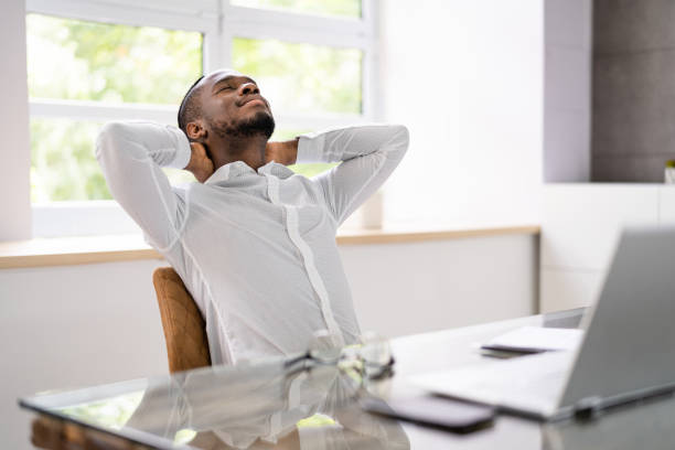 istock Advisor Man Relaxing In Office Chair 1410017384