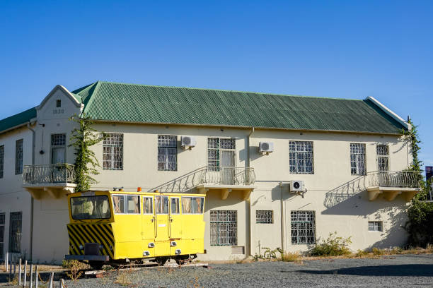 Windhoek Train Station in Khomas Region, Namibia, with an old railway carriage outside.