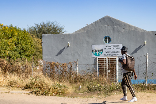 A man walks past The Holy Church of the Oath of Christ at Katutura Township near Windhoek in Khomas Region, Namibia