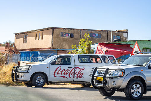 Coca Cola Logo at Katutura Township near Windhoek in Khomas Region, Namibia. Car number plates are visible.