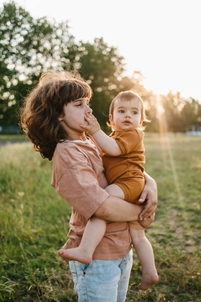 istock Brother holding his younger brother 1410020713