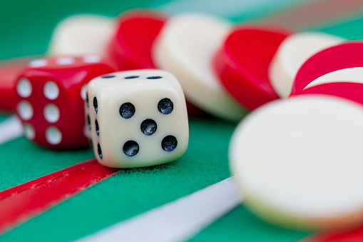 two dices double six playing backgammon on green wool cloth